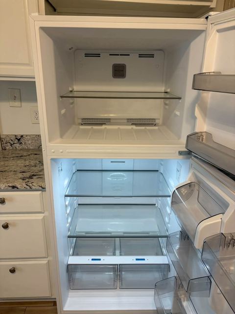 Open top-freezer refrigerator, interior